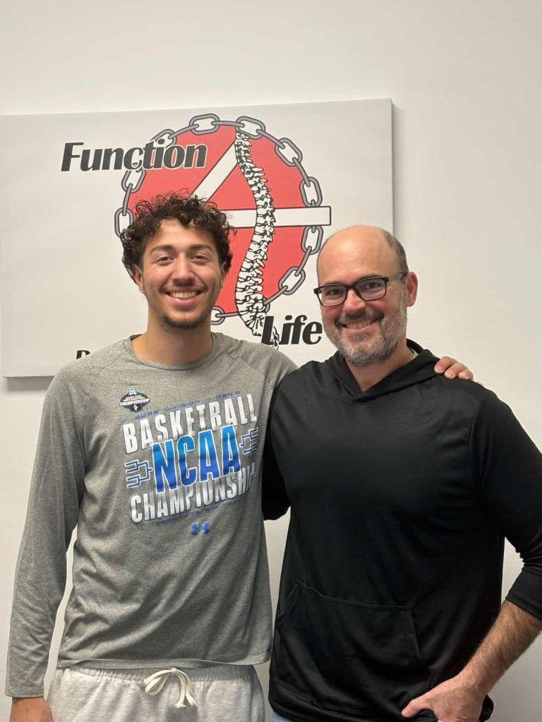 Dr. David Glazer, Chiropractor with a Patient